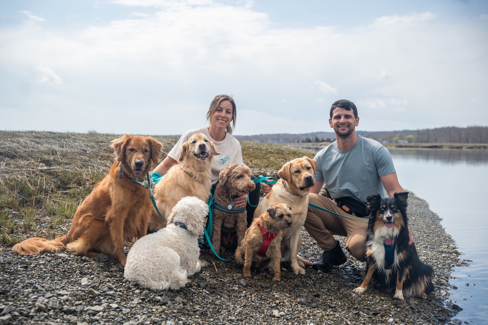 Anna and Jake Turner with the Marsh and Meadows pack beside the water